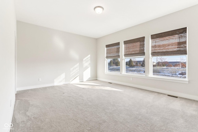 empty room with light colored carpet