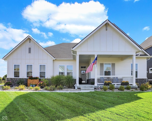 view of front of home featuring a front yard and a porch