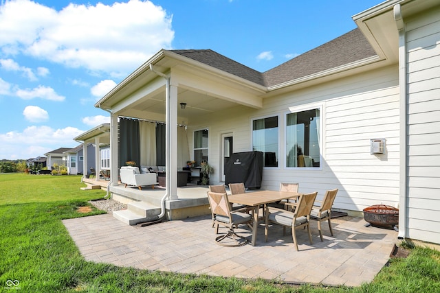 view of patio / terrace featuring an outdoor living space with a fire pit and area for grilling