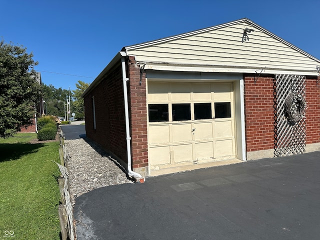 garage with a lawn