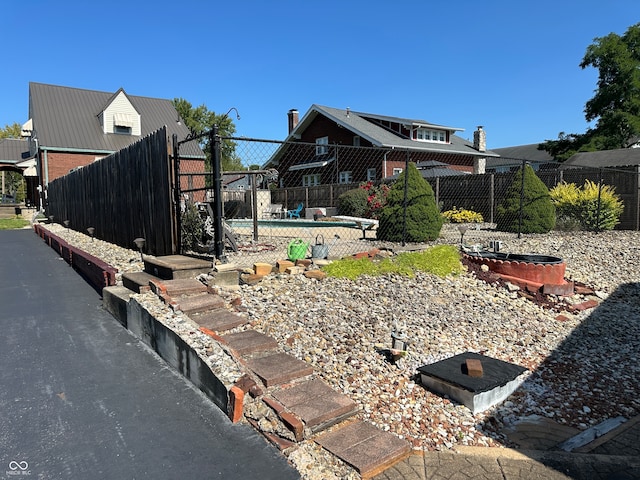 view of yard featuring a covered pool