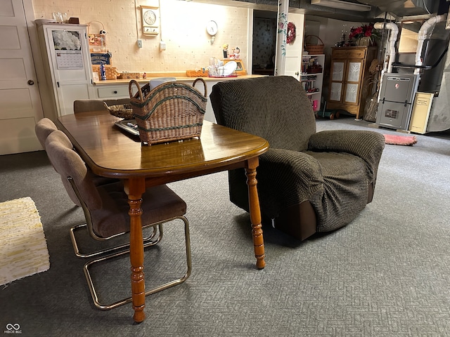 dining area with heating unit and carpet flooring