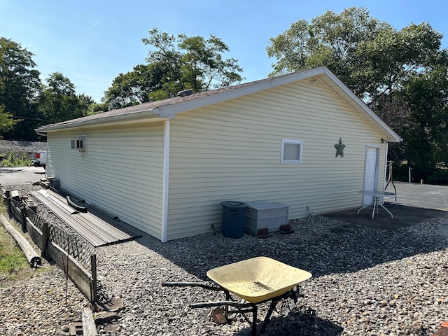 view of side of property featuring a patio