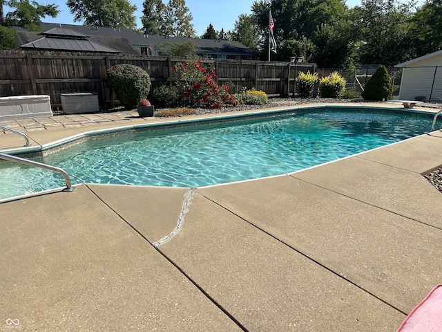 view of swimming pool with a patio