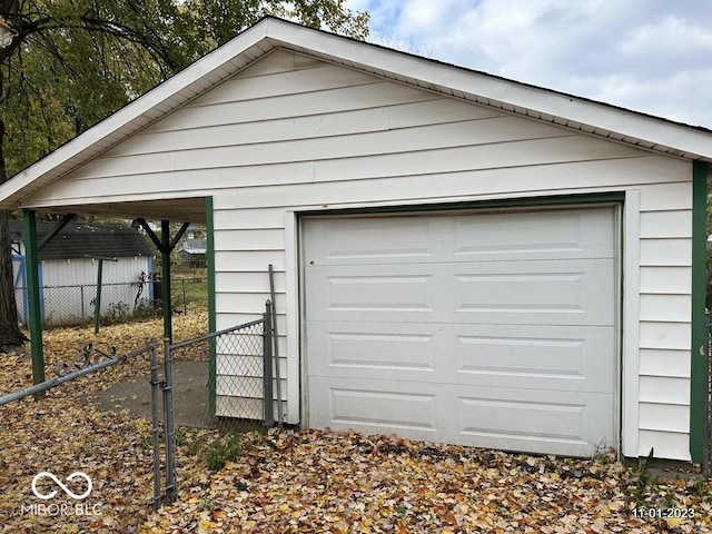 detached garage with fence