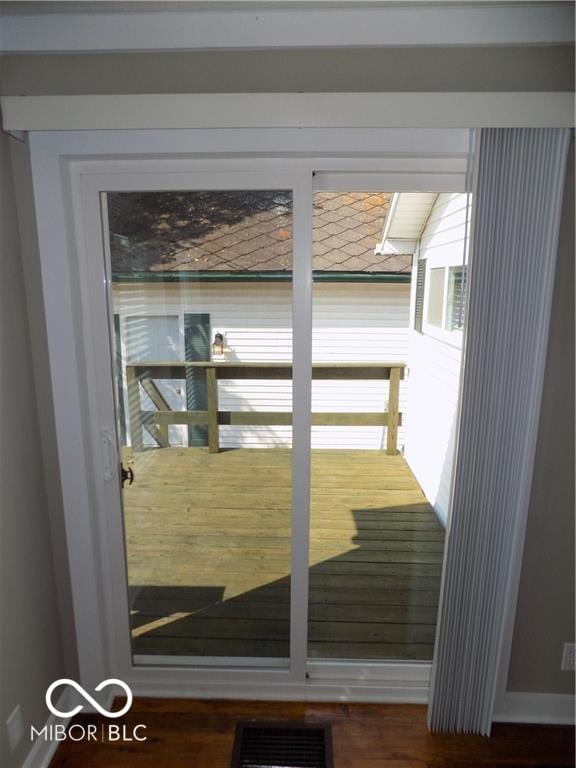 entryway with hardwood / wood-style floors