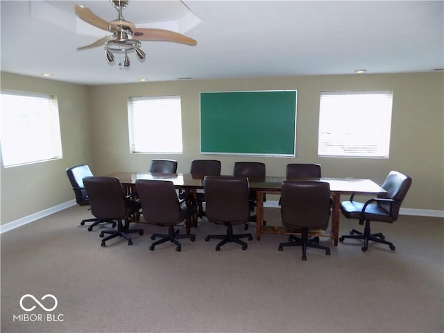 office space with carpet floors and ceiling fan