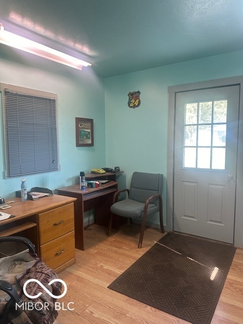 office area with light hardwood / wood-style flooring