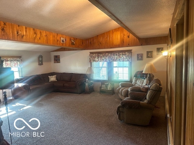 living room with lofted ceiling, a textured ceiling, wooden walls, and carpet