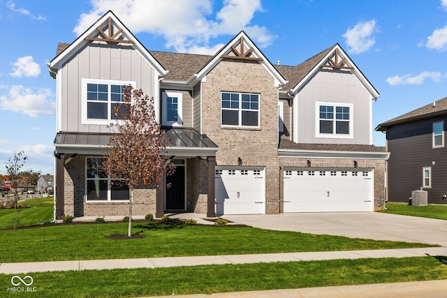 craftsman-style house featuring a garage and a front lawn