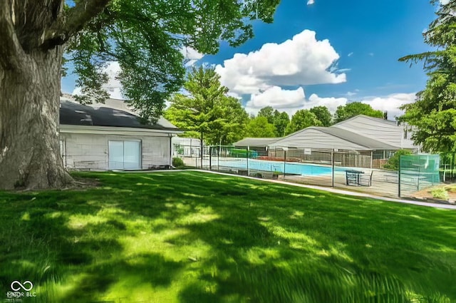 view of yard with tennis court