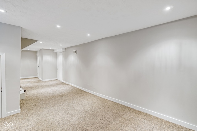 empty room with light colored carpet