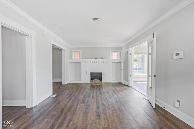 unfurnished living room with a fireplace, dark hardwood / wood-style floors, and ornamental molding