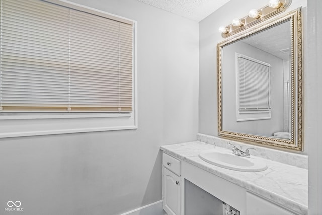 bathroom featuring vanity and a textured ceiling