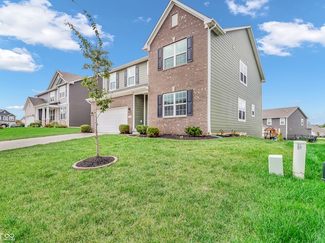 view of property featuring a garage and a front lawn