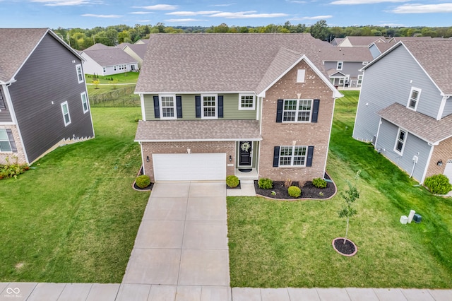 view of front facade with a garage and a front lawn