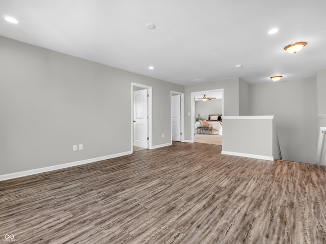 unfurnished living room with ceiling fan and hardwood / wood-style flooring