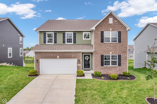 view of front of property featuring a garage and a front lawn