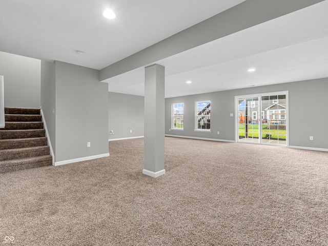 basement featuring carpet floors and a healthy amount of sunlight