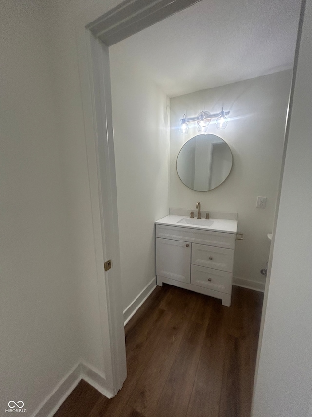 bathroom featuring vanity and hardwood / wood-style floors