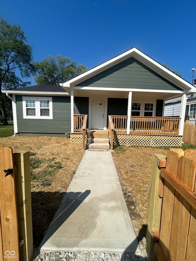 ranch-style home with a porch