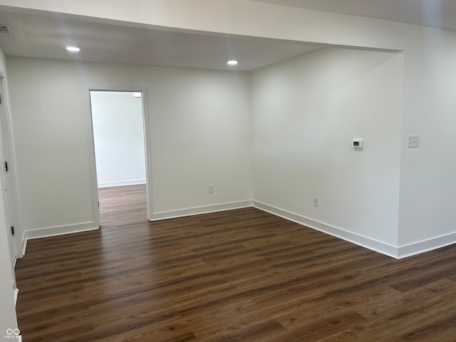 unfurnished room featuring dark hardwood / wood-style floors