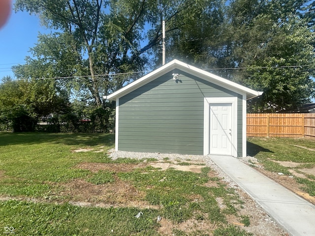 view of outdoor structure featuring a lawn