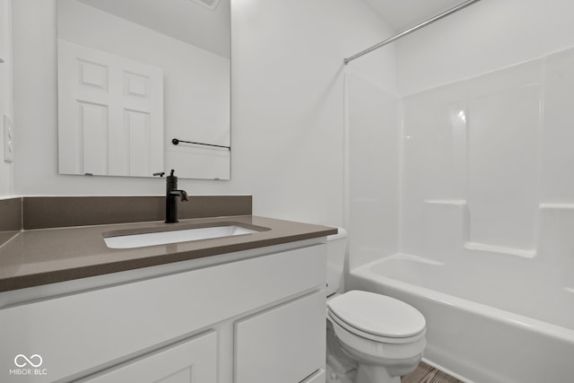 full bathroom with vanity, toilet, and shower / bathtub combination