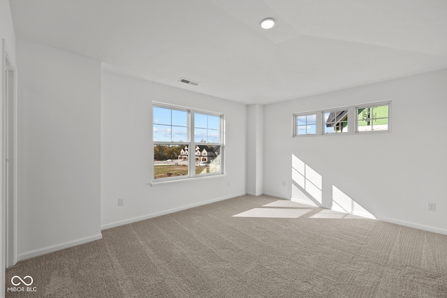 empty room with light colored carpet