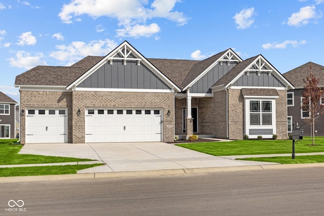 craftsman-style home featuring a garage and a front yard