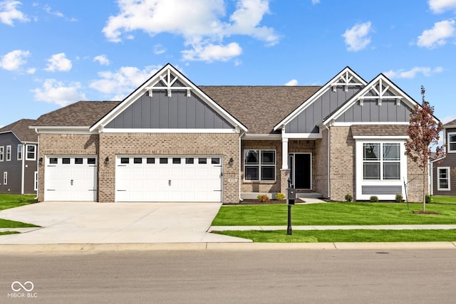 craftsman-style home featuring a garage and a front lawn