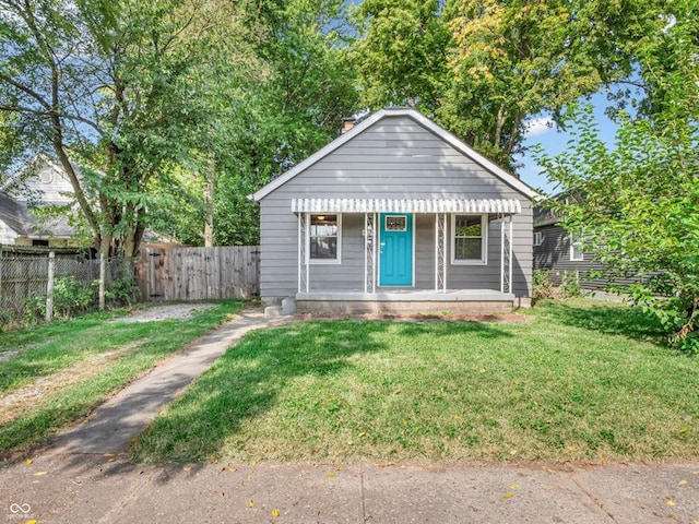 bungalow-style home featuring a front lawn