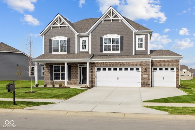 craftsman-style house with a front lawn and a garage