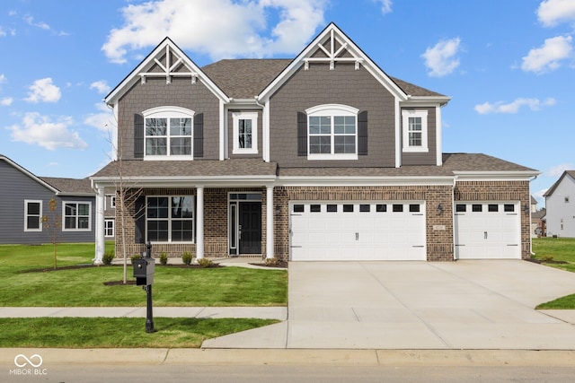 view of front facade with a garage and a front lawn