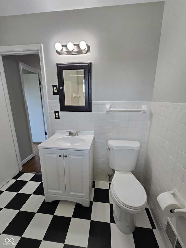 bathroom featuring tile walls, vanity, and tile patterned floors