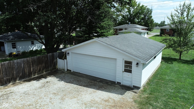 garage featuring a yard