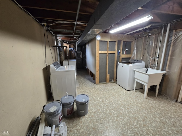 unfinished below grade area featuring washer and clothes dryer