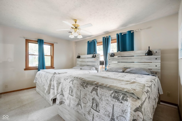 9235 N Gray Ave, Unionville, IN 47468 - bedroom with baseboards, a ceiling fan, carpet flooring, and multiple windows