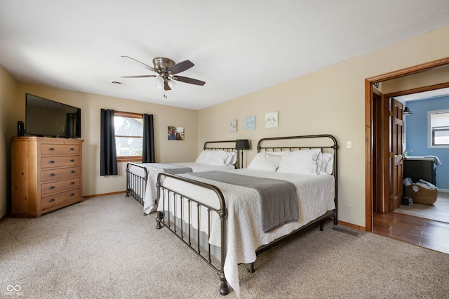 bedroom featuring ensuite bath, ceiling fan, and carpet floors