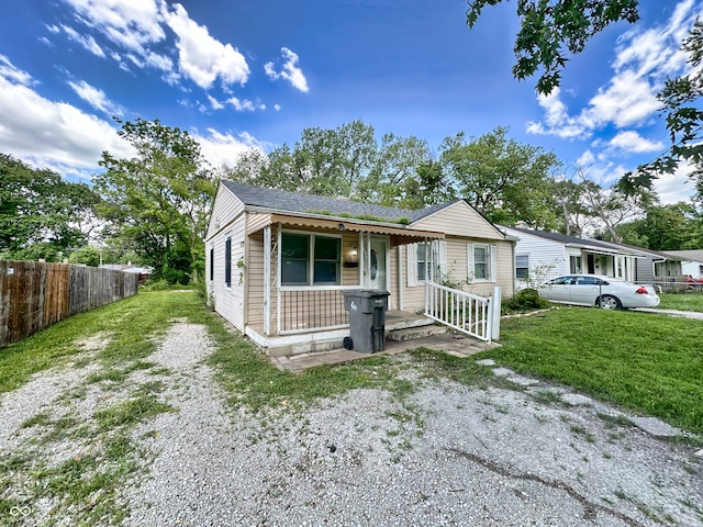 view of front of home featuring a porch and a front yard