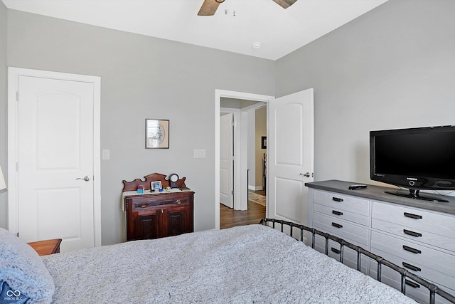 bedroom with a ceiling fan and wood finished floors