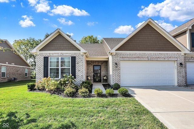 view of front of property featuring a front lawn and a garage