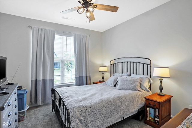 bedroom with carpet flooring, visible vents, and a ceiling fan