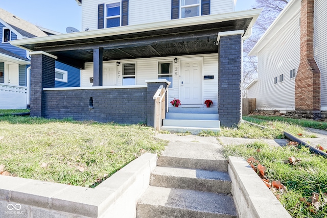 entrance to property with covered porch