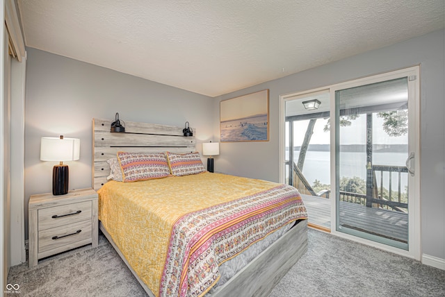 bedroom featuring light carpet, a textured ceiling, and access to outside