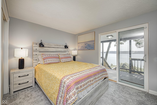 7587 Shady Side Dr, Bloomington, IN 47401 - carpeted bedroom featuring a textured ceiling and access to outside