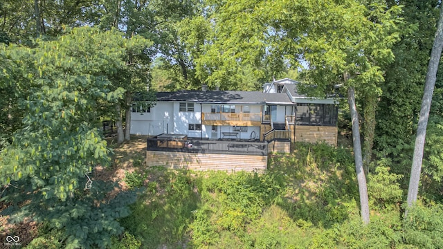 7587 Shady Side Dr, Bloomington, IN 47401 - back of house featuring a sunroom, stairway, roof with shingles, and a wooden deck