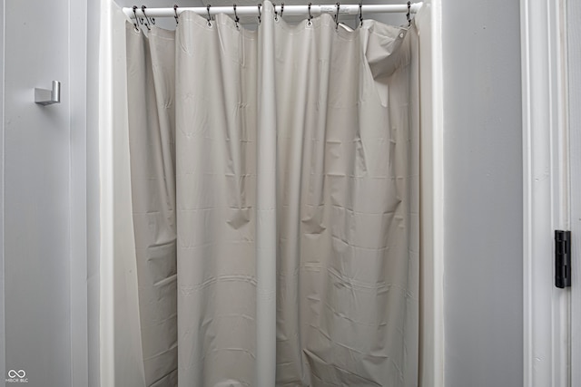 bathroom with a shower with shower curtain