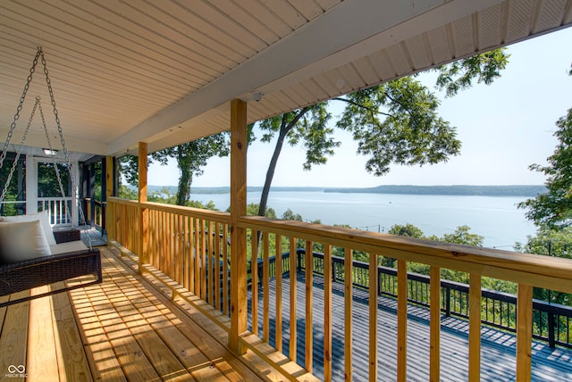 deck featuring a water view