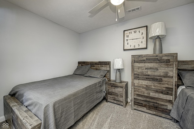 7587 Shady Side Dr, Bloomington, IN 47401 - bedroom featuring visible vents, ceiling fan, carpet floors, and a textured ceiling